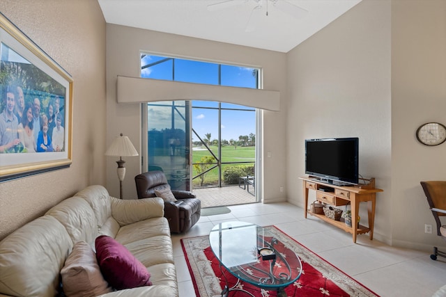 living room with light tile patterned floors, ceiling fan, and a healthy amount of sunlight