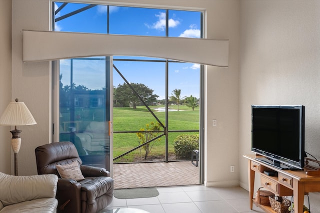 living room with light tile patterned floors and plenty of natural light