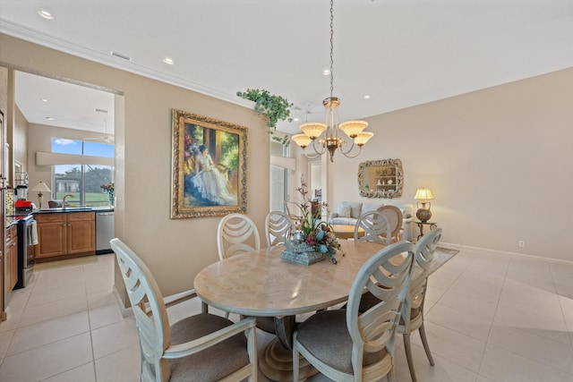 tiled dining space featuring a notable chandelier and sink