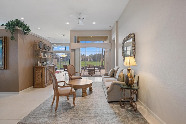 tiled living room featuring ceiling fan