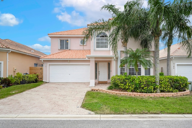 mediterranean / spanish-style house featuring a garage