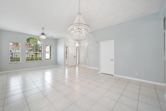 tiled empty room with ceiling fan with notable chandelier