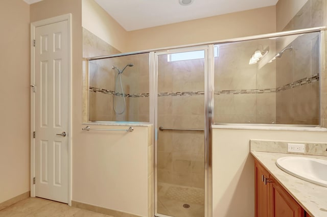 bathroom with vanity and a shower with shower door