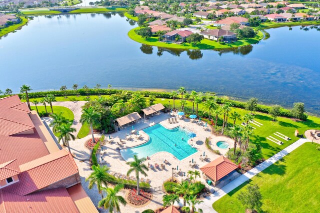 birds eye view of property with a water view