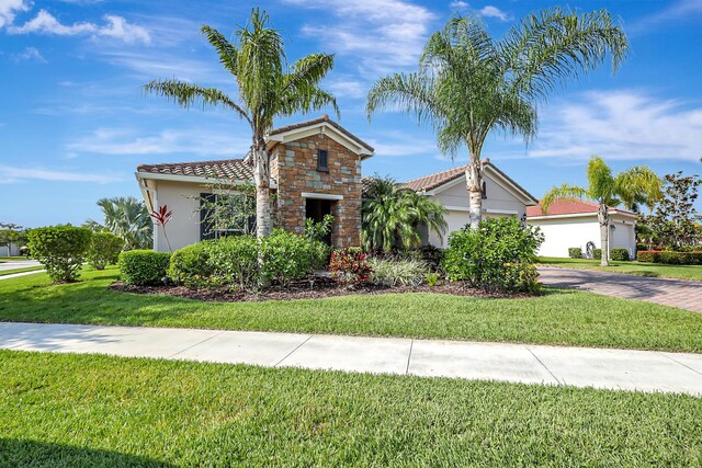 view of front facade featuring a garage and a front yard