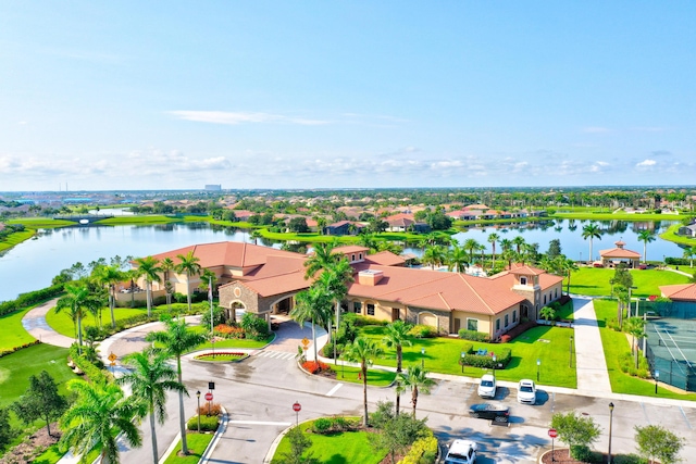 birds eye view of property with a water view