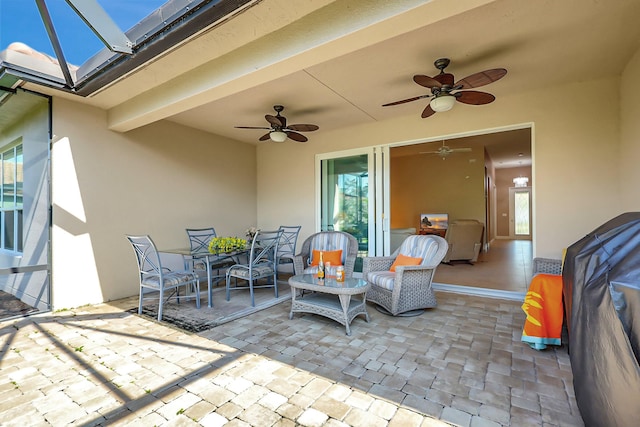 view of patio featuring ceiling fan