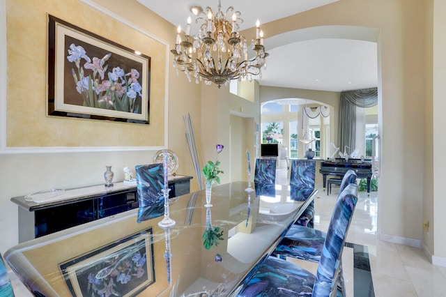 tiled dining room featuring a notable chandelier