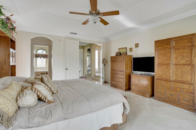 bedroom featuring ceiling fan, ornamental molding, and ensuite bath