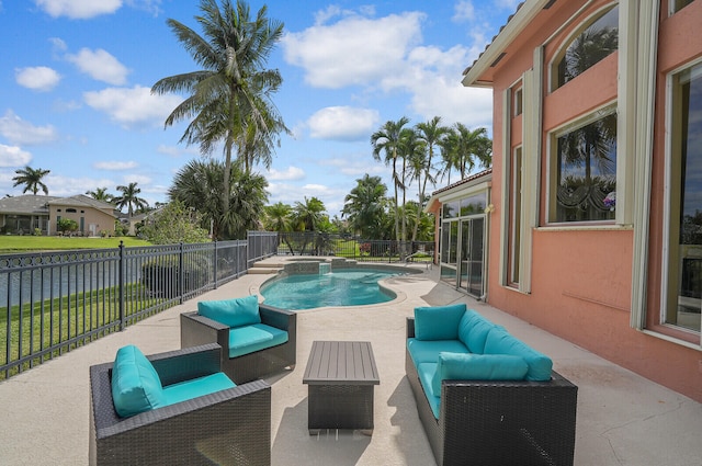 view of pool with outdoor lounge area and a patio