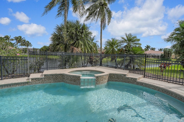 view of swimming pool featuring an in ground hot tub and a water view