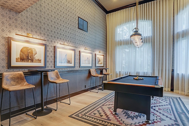 playroom with crown molding, pool table, and light wood-type flooring