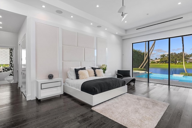 bedroom featuring access to exterior and dark hardwood / wood-style floors