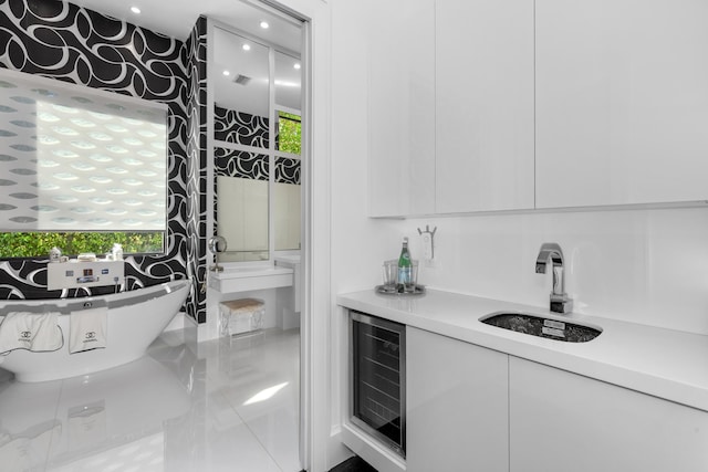 bar featuring white cabinetry, sink, and wine cooler