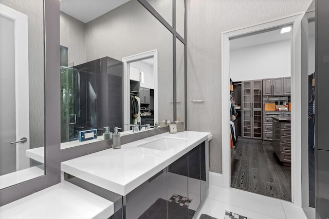 bathroom featuring hardwood / wood-style flooring and vanity