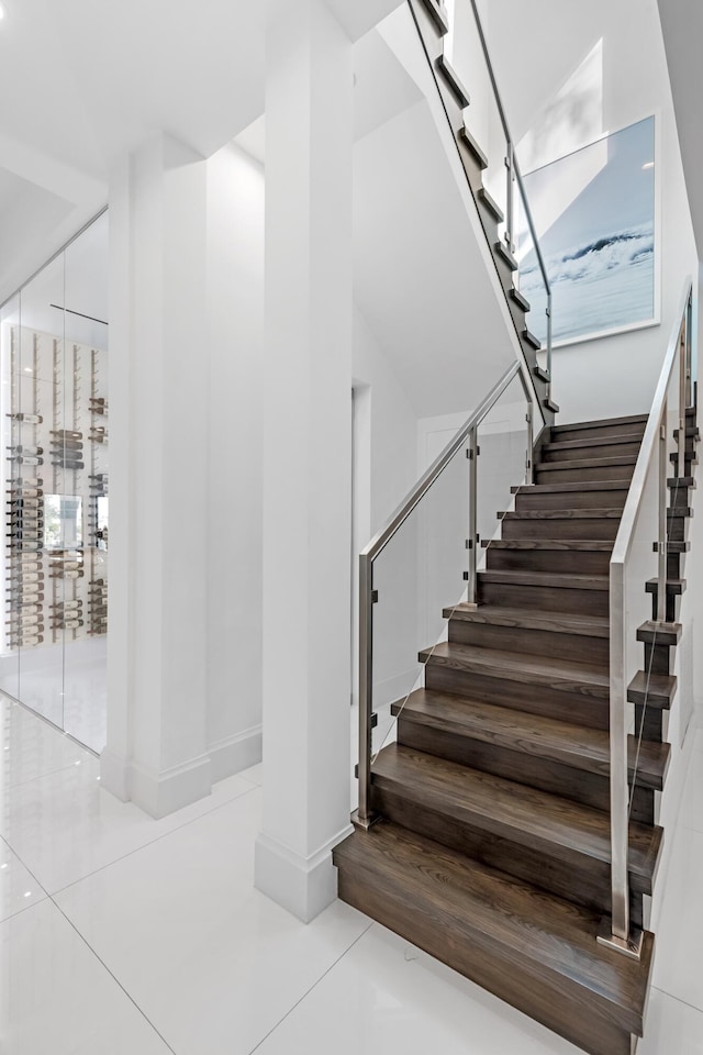 stairs with tile patterned flooring