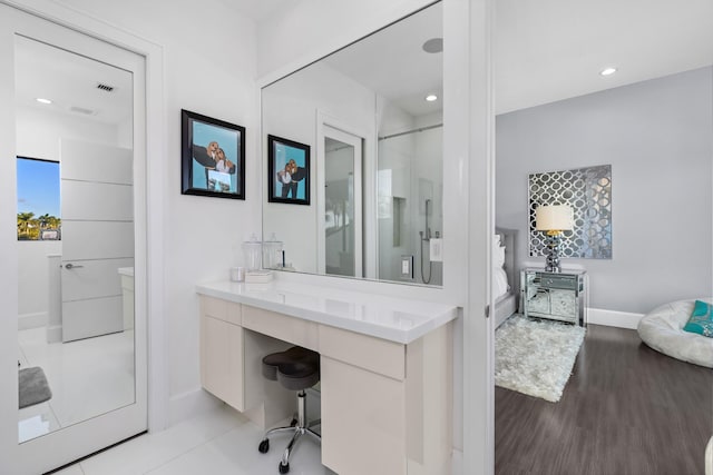 bathroom featuring wood-type flooring and vanity