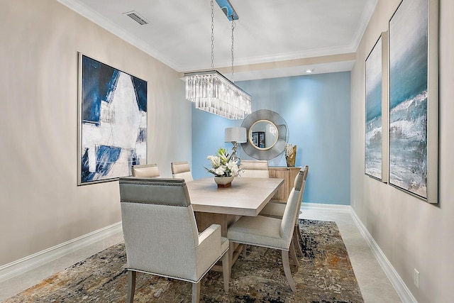 dining space featuring plenty of natural light, ornamental molding, and an inviting chandelier