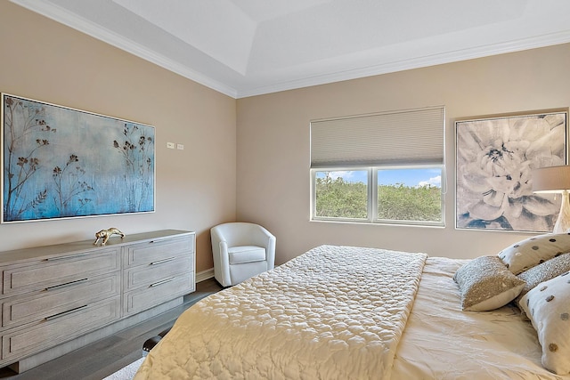 bedroom featuring wood-type flooring and ornamental molding