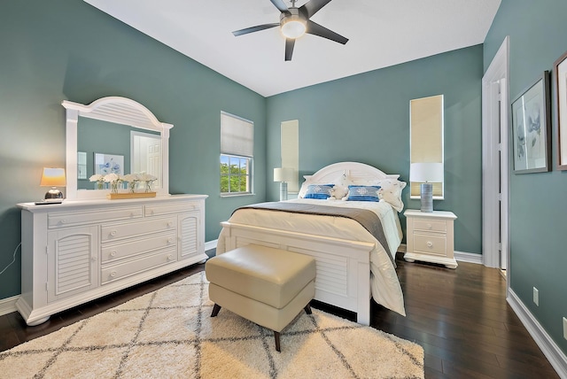 bedroom with ceiling fan and dark hardwood / wood-style floors