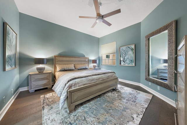 bedroom featuring dark hardwood / wood-style floors and ceiling fan