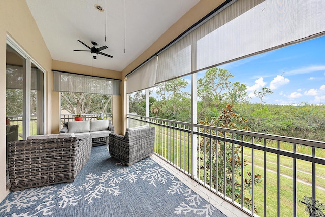 unfurnished sunroom with ceiling fan