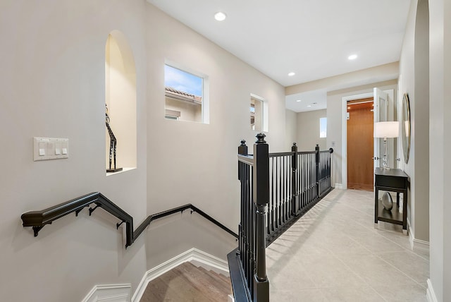 stairs with tile patterned floors