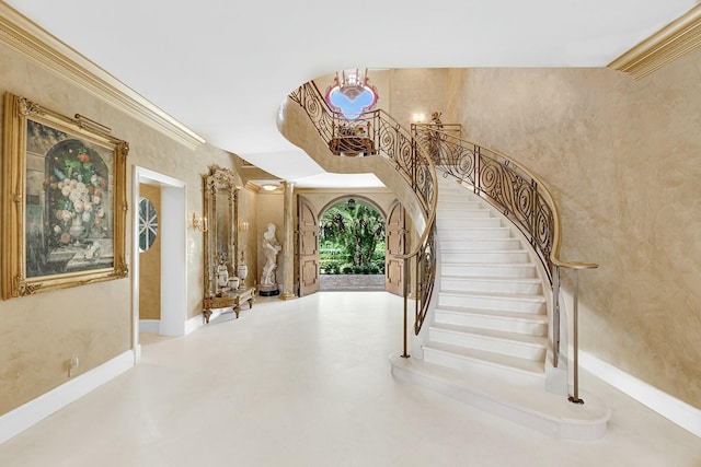 staircase featuring ornamental molding and concrete floors