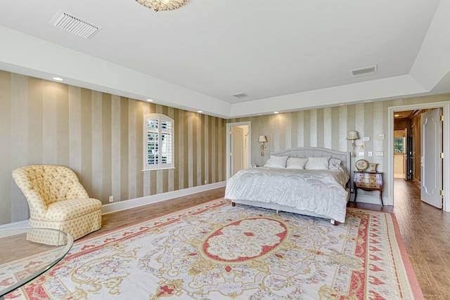 477 S Beach Rd, Jupiter Island, FL 33455 - bedroom featuring wood finished floors, wallpapered walls, and baseboards
