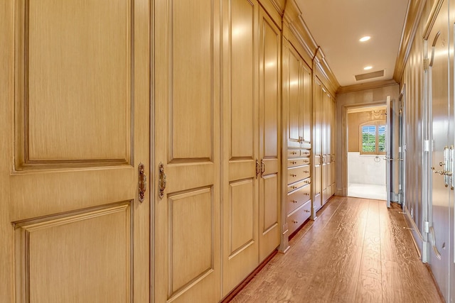 477 S Beach Rd, Jupiter Island, FL 33455 - hall featuring wood finished floors, ornamental molding, attic access, and recessed lighting