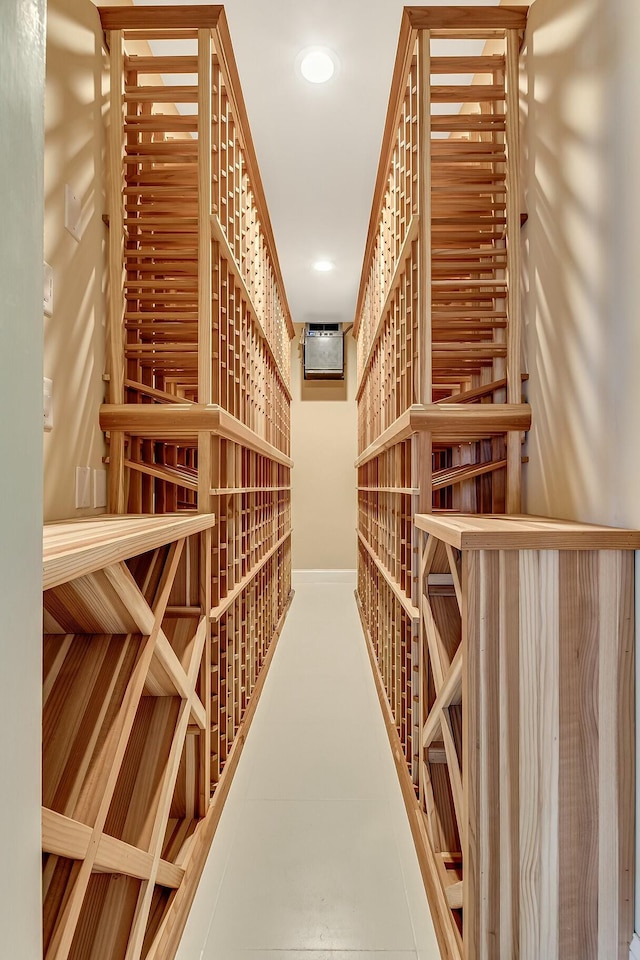 477 S Beach Rd, Jupiter Island, FL 33455 - wine area featuring recessed lighting, an AC wall unit, and baseboards