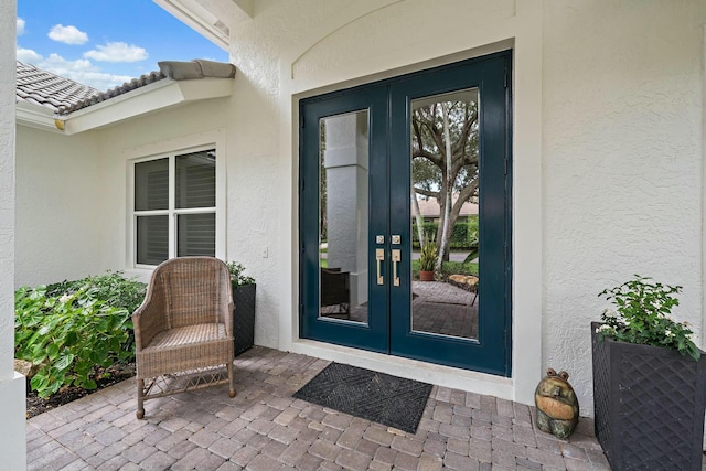 property entrance featuring french doors