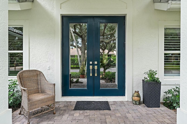 entrance to property featuring french doors