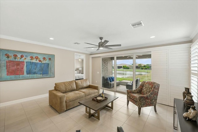 living room with ceiling fan, a water view, ornamental molding, and light tile patterned floors