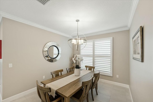 dining space with light tile patterned flooring, ornamental molding, a textured ceiling, and an inviting chandelier