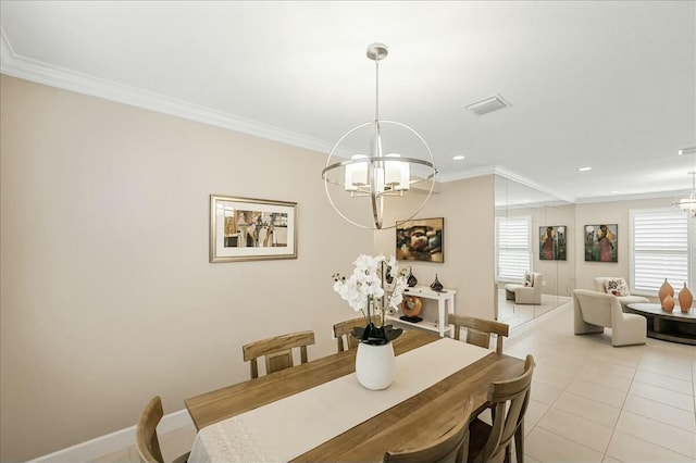 dining room featuring a chandelier, light tile patterned floors, and ornamental molding