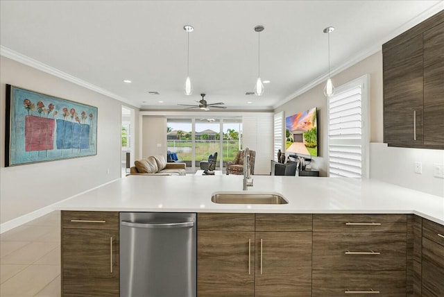 kitchen featuring ceiling fan, sink, crown molding, decorative light fixtures, and light tile patterned floors