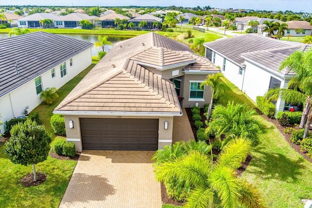 birds eye view of property with a water view