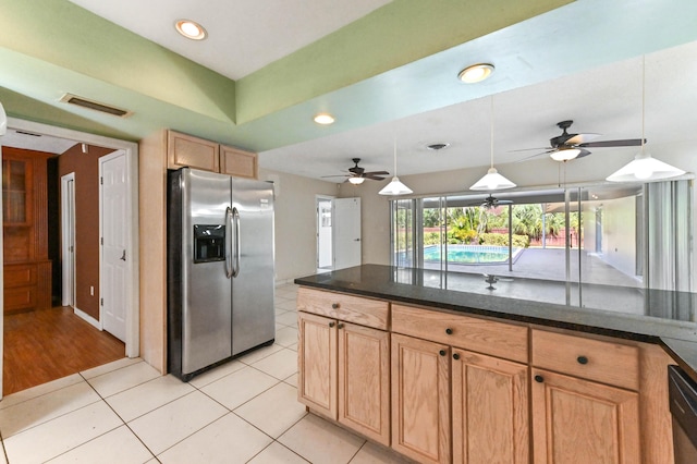 kitchen with ceiling fan, light tile patterned floors, pendant lighting, and appliances with stainless steel finishes