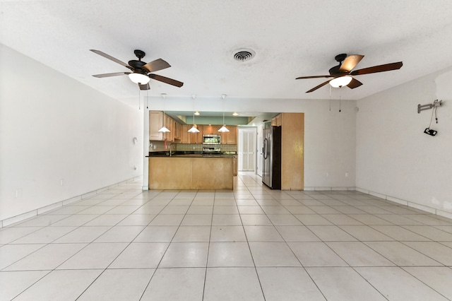 kitchen with ceiling fan, light tile patterned floors, hanging light fixtures, and appliances with stainless steel finishes