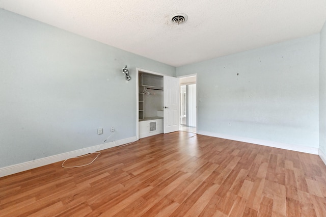 unfurnished room featuring light hardwood / wood-style flooring