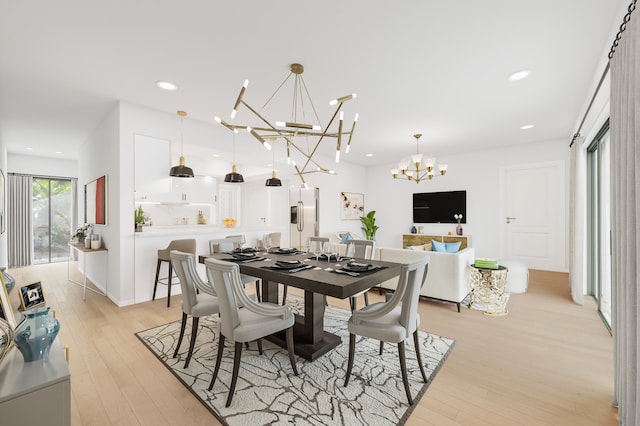 dining area featuring light hardwood / wood-style floors and a notable chandelier