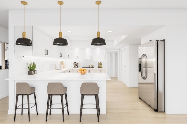 kitchen featuring kitchen peninsula, white cabinets, decorative light fixtures, and stainless steel fridge with ice dispenser