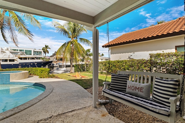 view of patio / terrace featuring a fenced in pool