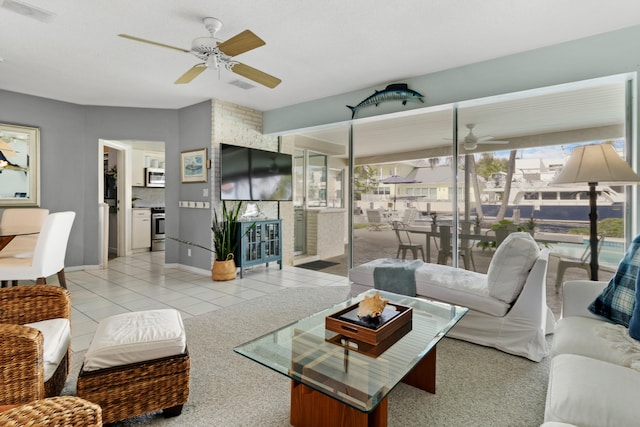 tiled living room with ceiling fan