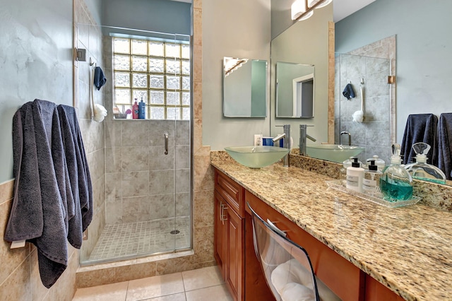 bathroom featuring vanity, tile patterned floors, and an enclosed shower