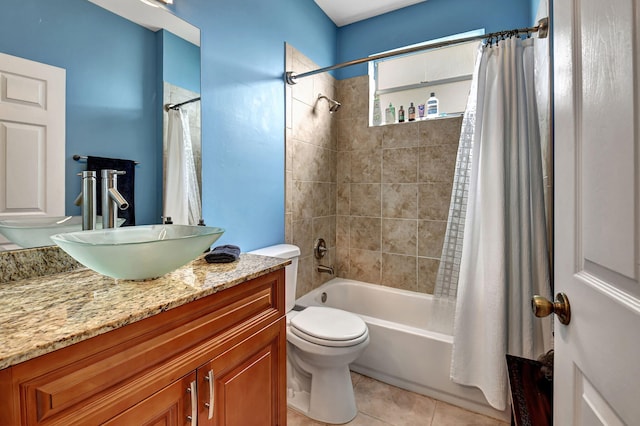 full bathroom with tile patterned flooring, vanity, shower / tub combo, and toilet