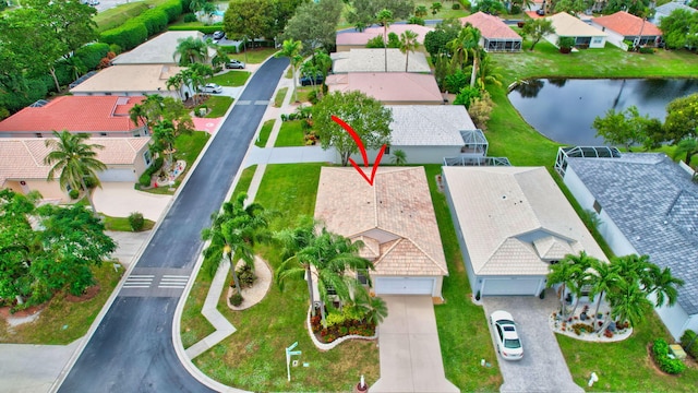 birds eye view of property featuring a water view