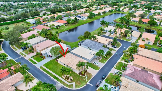 birds eye view of property featuring a water view