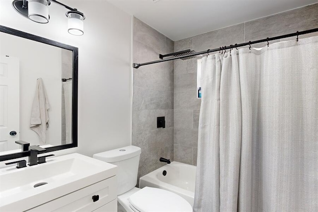 full bathroom featuring shower / bath combo, vanity, and toilet